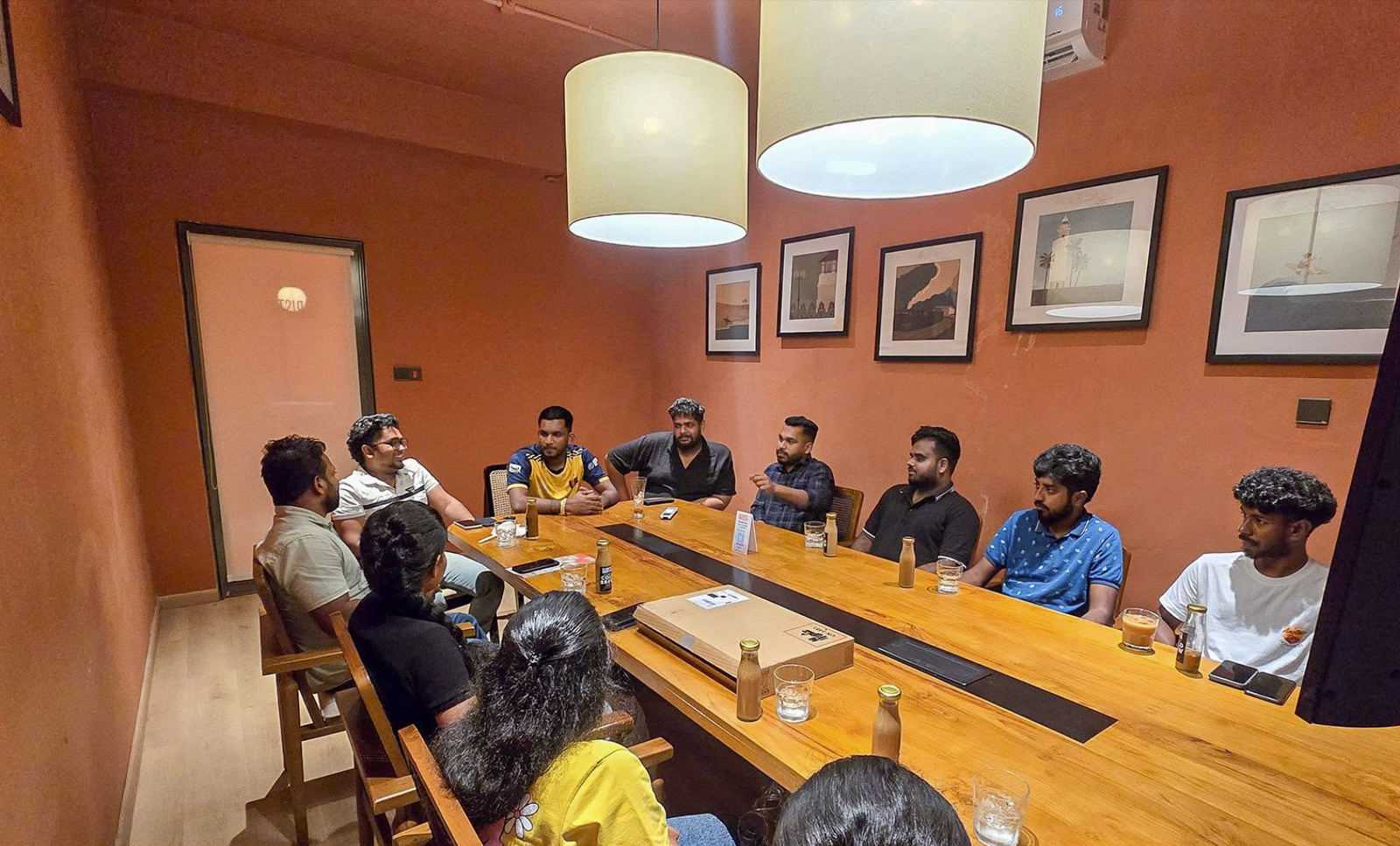 UNIC LKAY team gathered around a table for their first meeting